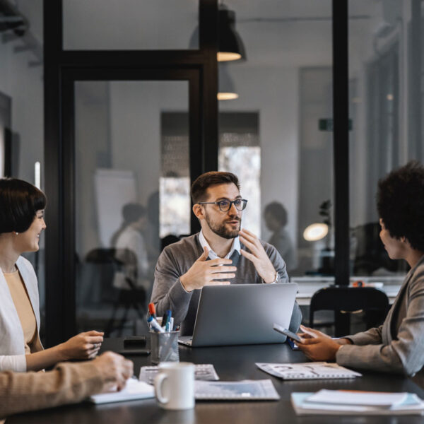 Expert-Guidance-Professional-meeting-with-laptop-and-documents